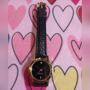 Black and gold ladies SKC watch
